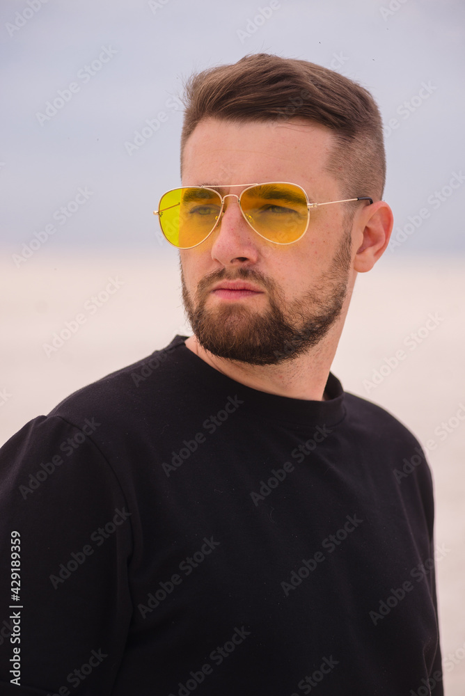 Portrait of bearded man in yellow glasses outdoor Portrait of bearded man in yellow glasses outdoor