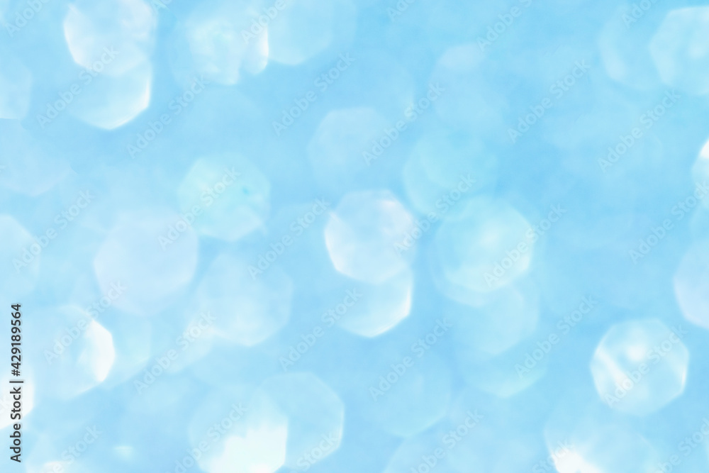 Shiny blurred blue background with bokeh for a festive mood. Greeting card template for fun. Shiny blurred blue background with bokeh for a festive mood. Greeting card template for fun.