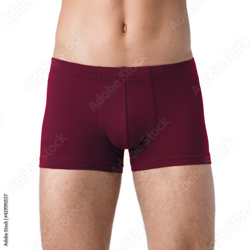 Men's health concept. Close up cropped photo of man's genitals, he is wearing white tight boxer-shorts isolated on white background