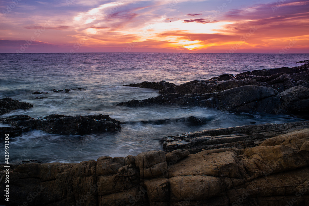 sunset over the sea with dramatic sky