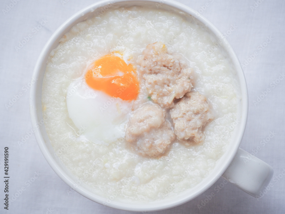 Top view of Rice porridge with minced pork and soft-boiled egg Top view of Rice porridge with minced pork and soft-boiled egg