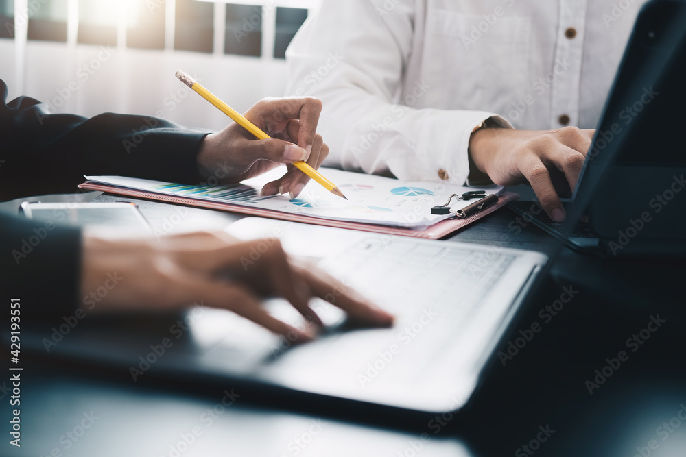 Business People Meeting to analyse and discuss and brainstorming the financial report chart data in office Financial advisor teamwork concept Business People Meeting to analyse and discuss and brainstorming the financial report chart data in office Financial advisor teamwork concept