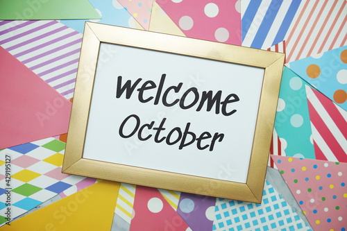 Welcome October text on colorful background