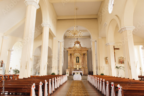 A large beautiful church is decorated for the wedding ceremony of the newlyweds, Lida, April 2021 photo