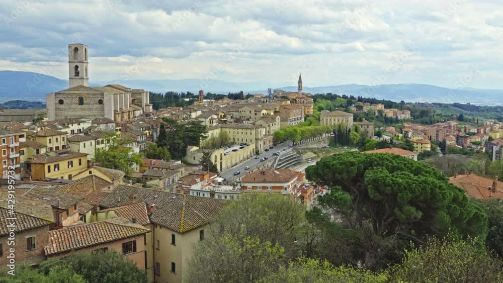 Cityscape of the city of Perugia. Above the roofs stand the bell towers of the convent of San Domenico and the church of San Pietro. Perugia, Umbria Cityscape of the city of Perugia. Above the roofs stand the bell towers of the convent of San Domenico and the church of San Pietro. Perugia, Umbria