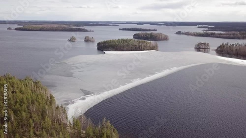 Melting ice floes at lake Puruvesi in spring photo