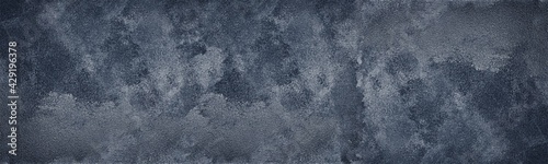Dark blue shabby textured wall wide texture. Black gloomy abstract grunge panoramic background