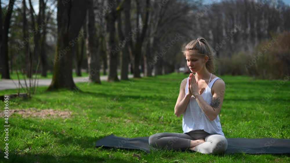 Yoga practice and meditation outdoor. Girl in the park Yoga practice and meditation outdoor. Girl in the park