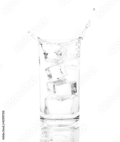 cold water with ice on glass isolated white background