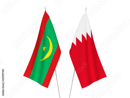 National fabric flags of Bahrain and Islamic Republic of Mauritania isolated on white background. 3d rendering illustration. photo