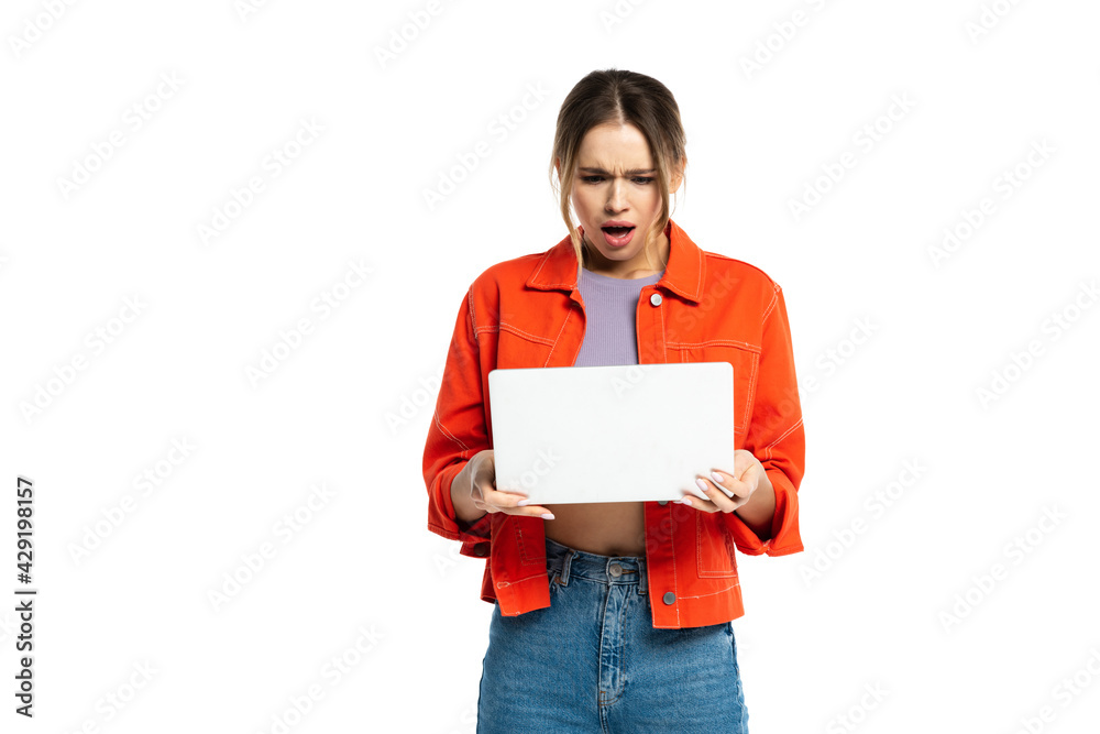 shocked young woman holding laptop isolated on white shocked young woman holding laptop isolated on white