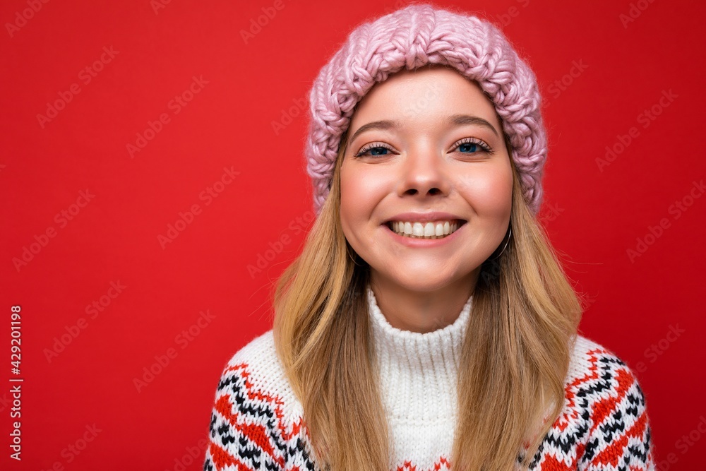 Closeup photo of beautiful happy smiling young blonde woman standing isolated over colourful background wall wearing everyday trendy clothes looking at camera showing facial emotions Closeup photo of beautiful happy smiling young blonde woman standing isolated over colourful background wall wearing everyday trendy clothes looking at camera showing facial emotions