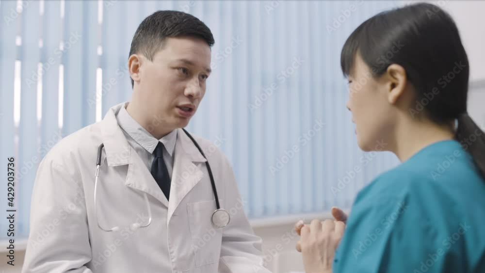 Strict boss yelling at female nurse in hospital, mistake at work, stressful job Strict boss yelling at female nurse in hospital, mistake at work, stressful job