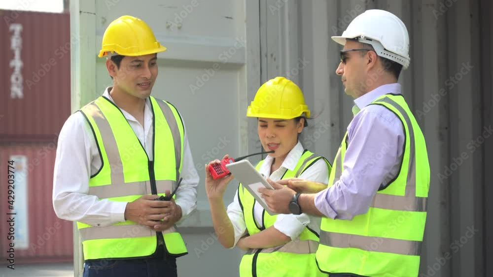 group of diversity harbor worker discussion and using digital tablet checking quality inside Containers box together at warehouse logistic in Cargo. teamwork of import export shipping business group of diversity harbor worker discussion and using digital tablet checking quality inside Containers box together at warehouse logistic in Cargo. teamwork of import export shipping business