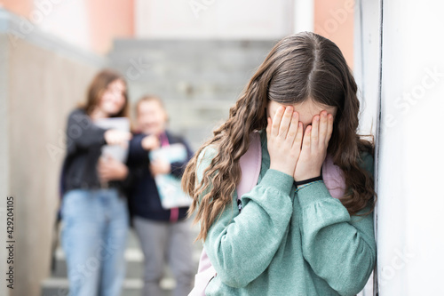 Bullied child at the school. photo