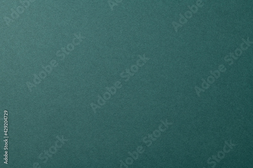深緑色の質感のある紙の背景テクスチャー