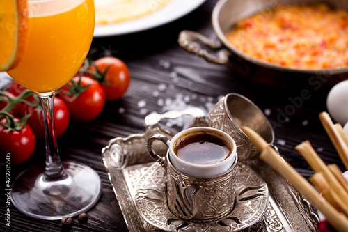 Assorted Middle Eastern and arabic dishes on a dark rustic background. Hummus, tabbouleh, pita, meat kebab, falafel, baklava. Halal food. Top view. Turkish foods, Turkish pizza, Turkish breakfast