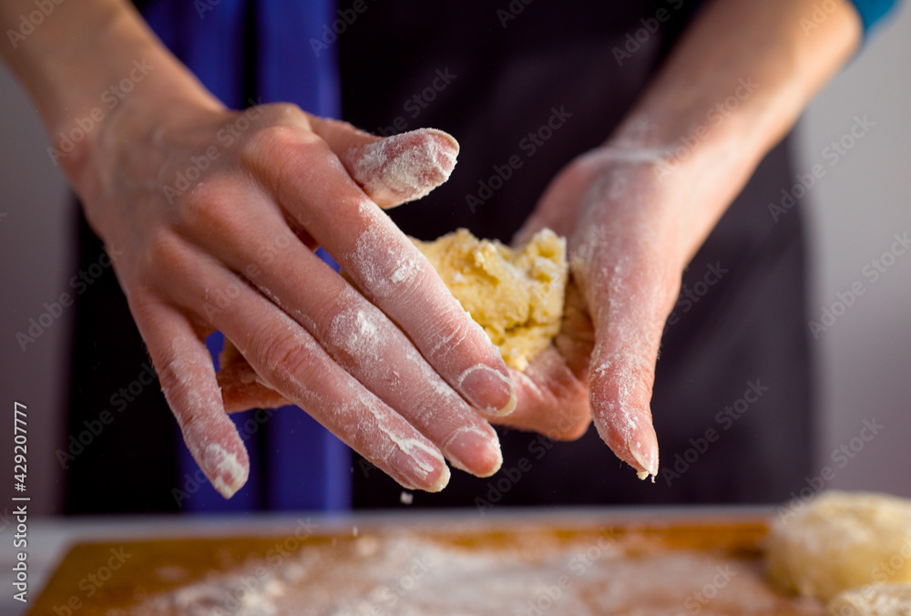 cheesecake and with beautiful delicate women's hands, cottage cheese pancakes with flour