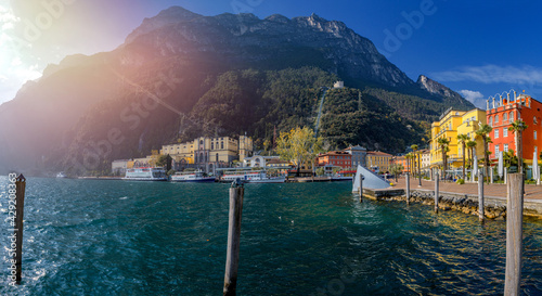 View of the beautiful Lake Garda surrounded by mountains, Scenic view of sunset at Lake Garda in the Riva del Garda with the beautiful sunset colors, italy