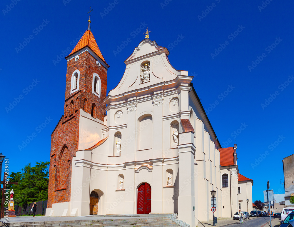 Medieval gothic church of Virgin Mary Assumption at Franciszkanska street in old town historic city center of Gniezno in Grater Poland region Medieval gothic church of Virgin Mary Assumption at Franciszkanska street in old town historic city center of Gniezno in Grater Poland region