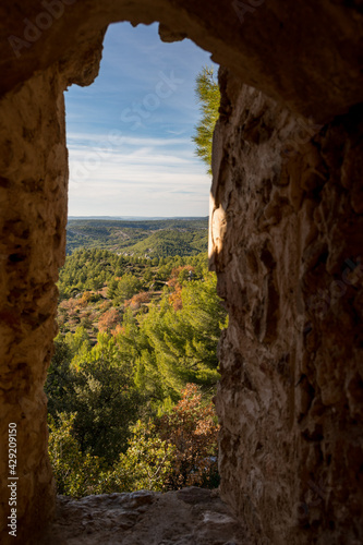 Provence landscape seen through a hole in a rock in Provence, France during summer