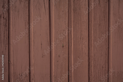 Texture of old wooden planks painted in brown