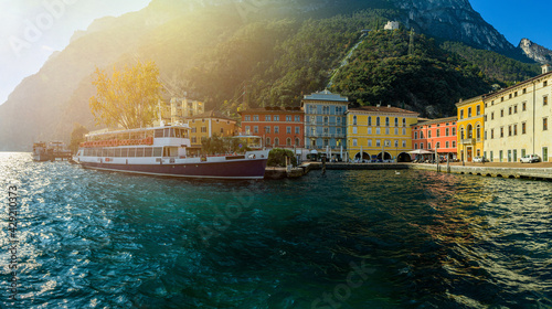 View of the beautiful Lake Garda surrounded by mountains, Scenic view of sunset at Lake Garda in the Riva del Garda with the beautiful sunset colors, italy