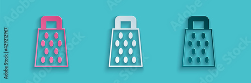 Paper cut Grater icon isolated on blue background. Kitchen symbol. Cooking utensil. Cutlery sign. Paper art style. Vector