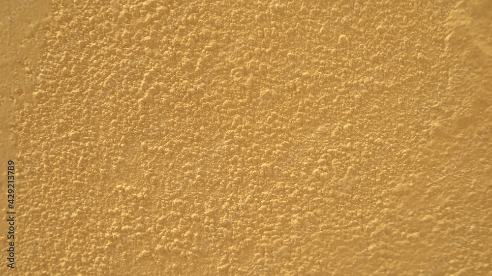 A Yellow cement wall is suitable for making a background. A Yellow cement wall is suitable for making a background.