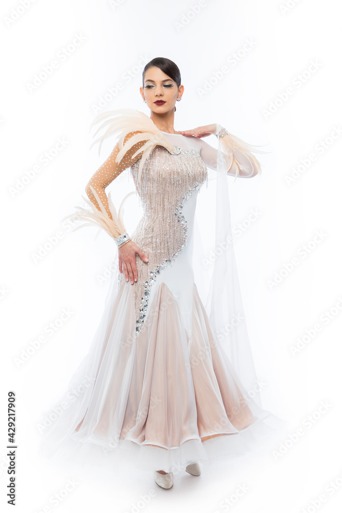 Fototapeta premium Beautiful young woman in an amazing white Latino dress.