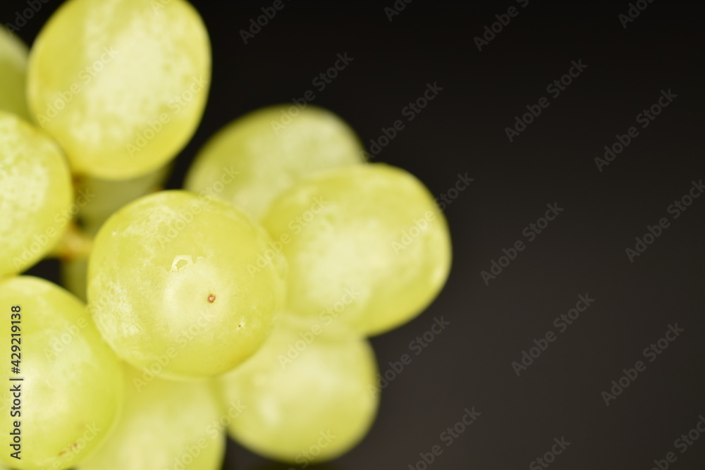 Several organic ripe grapes, close-up, isolated on black. Several organic ripe grapes, close-up, isolated on black.