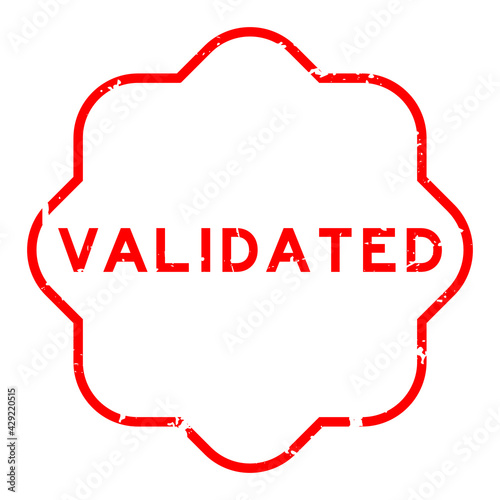 Grunge red validated word rubber seal stamp on white background