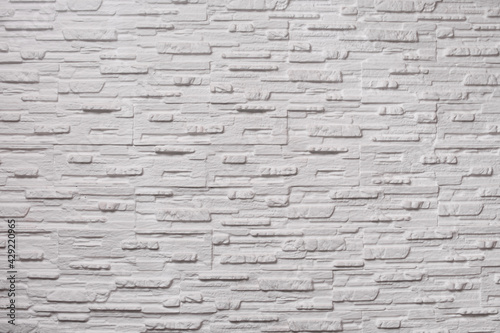 Background texture of white narrow bricks. masonry. copy space. 