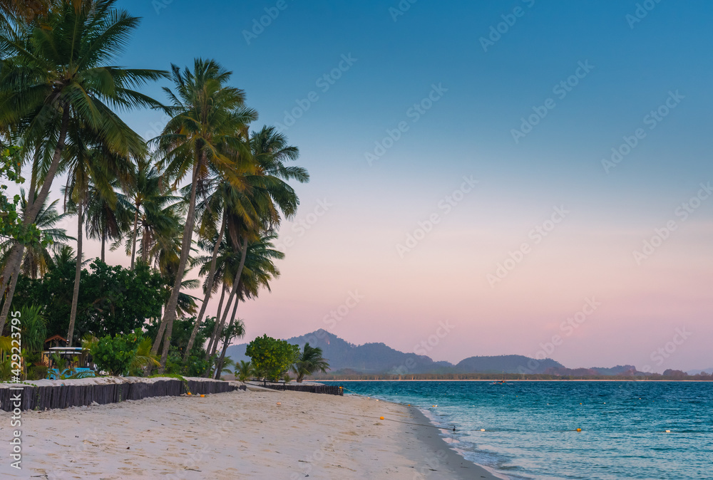 Landscape of paradise tropical island beach, sunset shot.