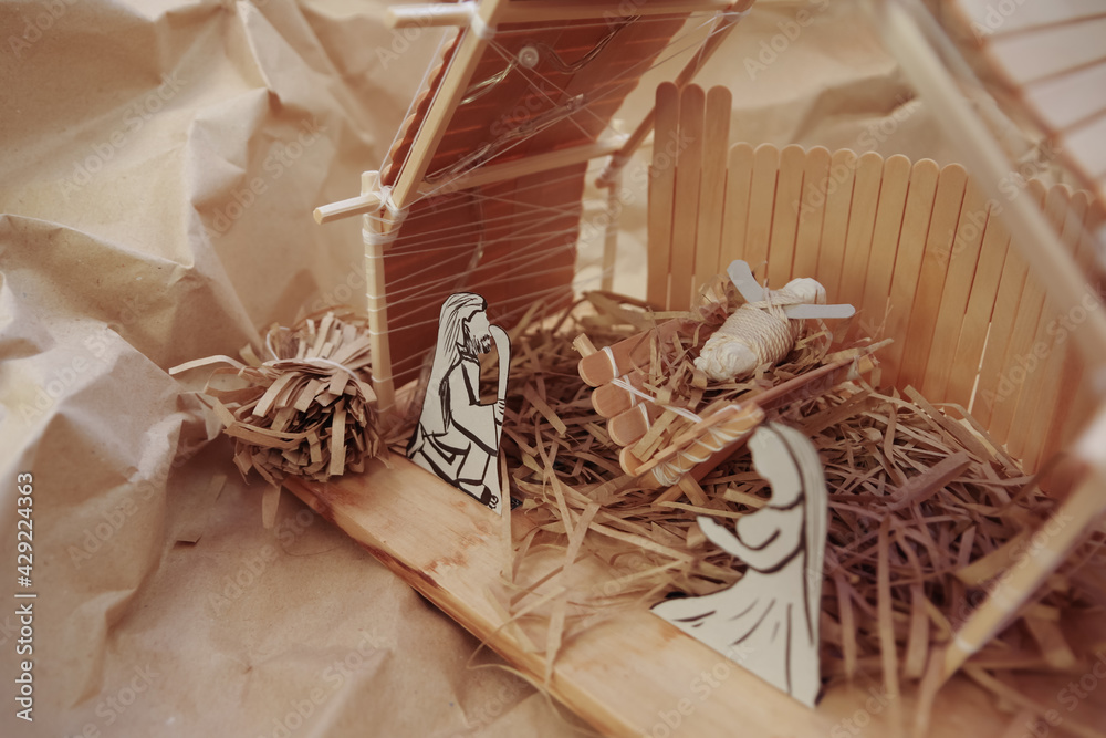 Obraz premium tokyo, japan, 22-09-2020, Traditional christmas pappresentation of the Jesus Nativity handmade with ice cream sticks.