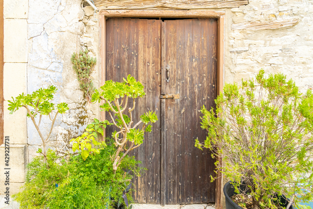 November 2020. Kato Drys in Larnaca District, Cyprus. Wooden door in The traditional village of Kato Drys in Cyprus November 2020. Kato Drys in Larnaca District, Cyprus. Wooden door in The traditional village of Kato Drys in Cyprus