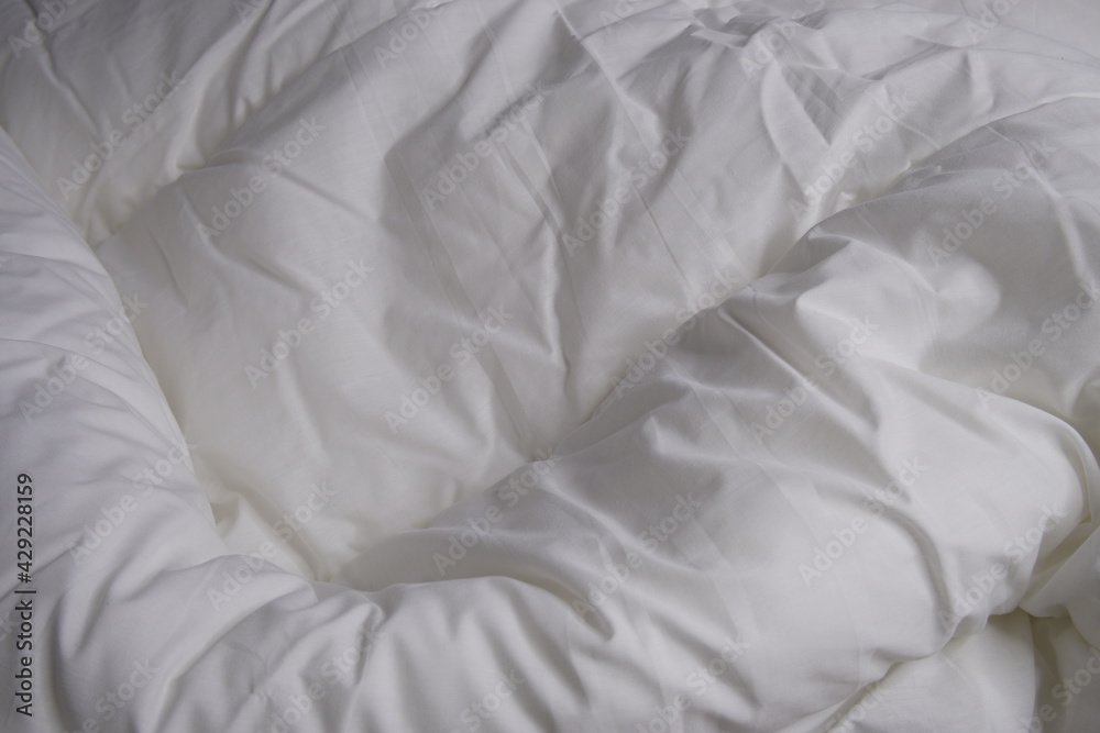 White blanket. Linens. Bed. Interior. Texture. Background