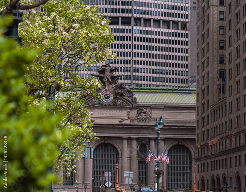 Grand central building with blooming trees in the foreground 