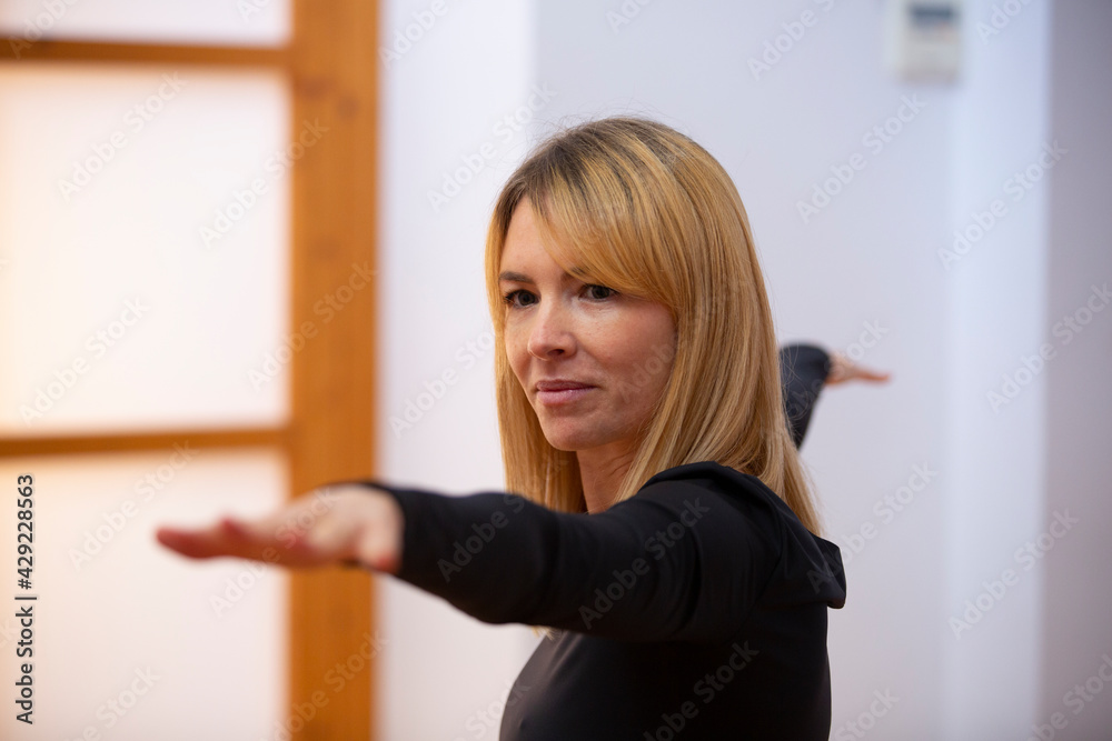 Young woman practicing yoga in a Japanese style room Young woman practicing yoga in a Japanese style room
