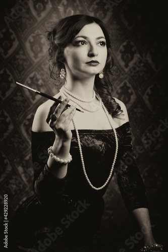 Fotografie Black and white retro female portrait in the style of 20s or 30s