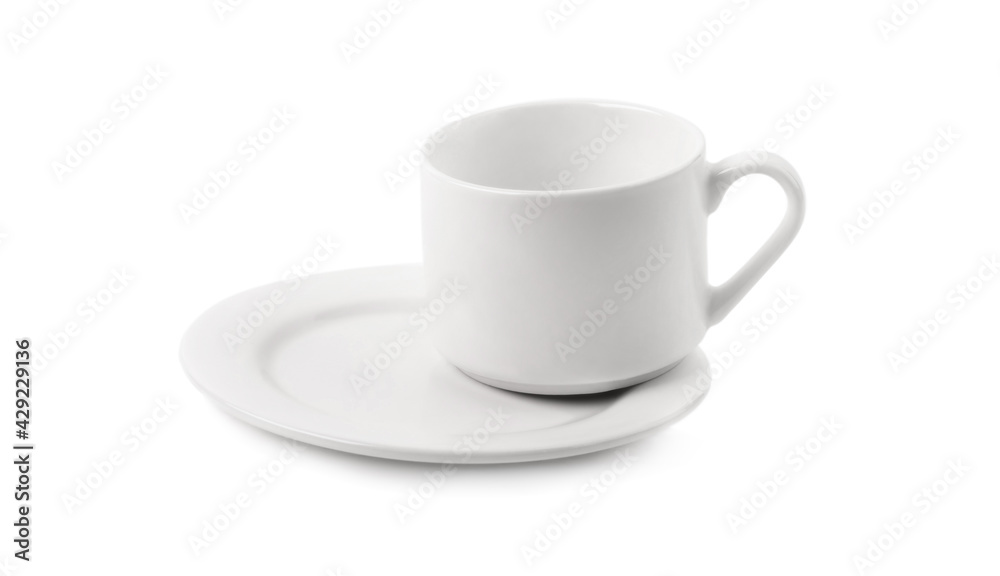 Empty cup standing on plate isolated on a white background Empty cup standing on plate isolated on a white background