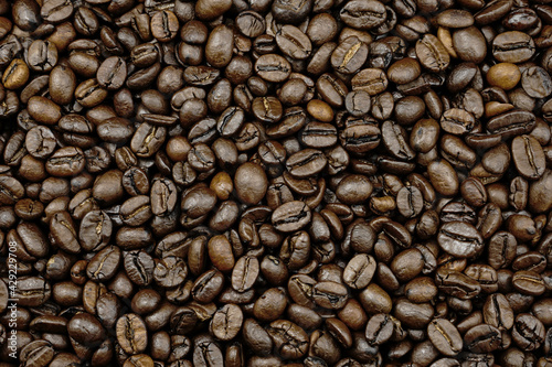 Coffee beans background top view.