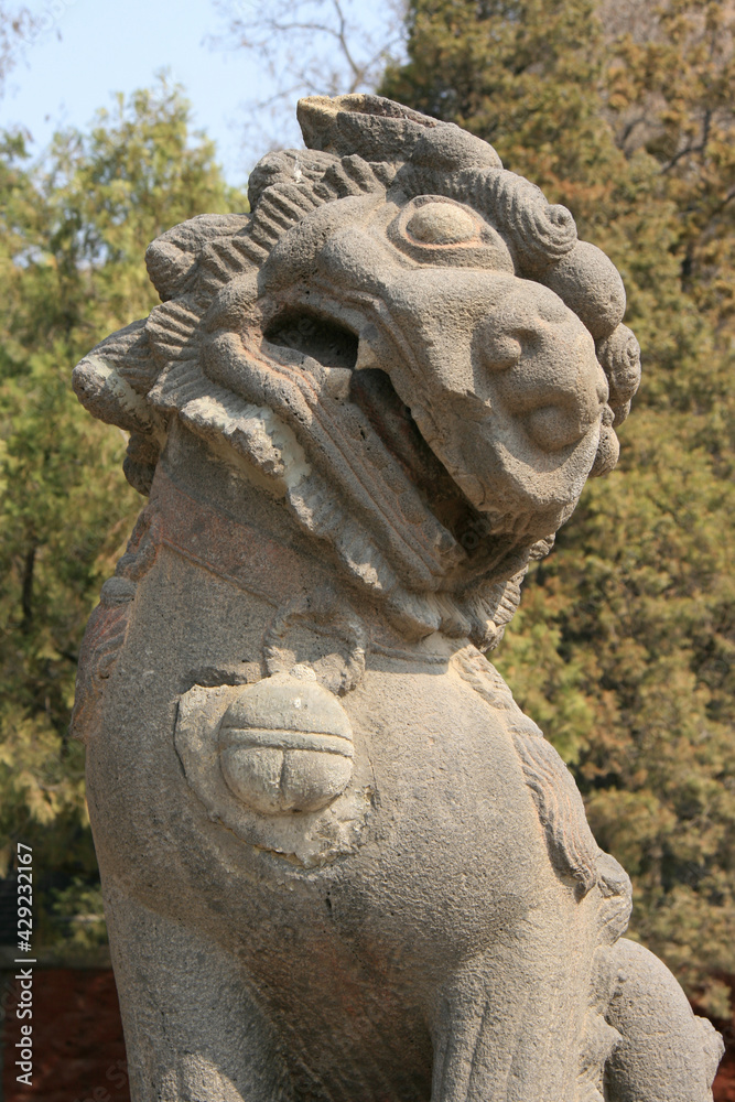 statue of lion at yungang caves in datong in china 