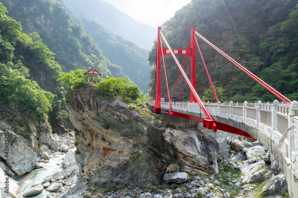 Red Bridge above and Chinese Temple Pagoda on Hill in Taroko National Park Hualien