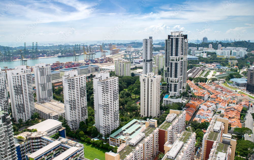 Naklejka premium Apartment Buildings and Skyscrapers by Singapore Port - Singapore, Southeast Asia