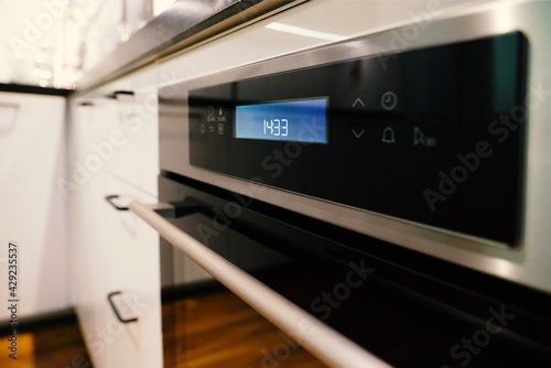 Background, blur, out of focus, bokeh. Electric oven built-in kitchen furniture.