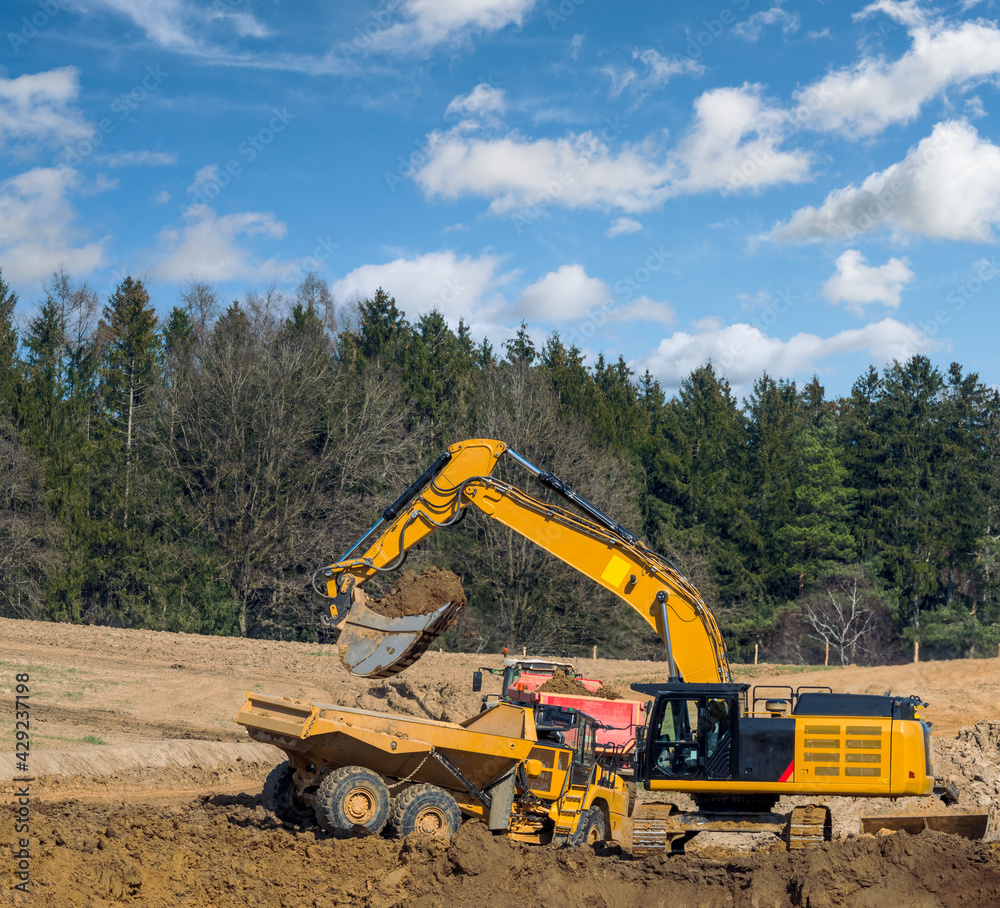 Yellow earth mover at a construction site Yellow earth mover at a construction site