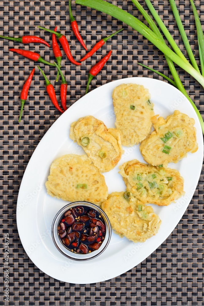 Traditional indonesian food. Tempe Mendoan. Indonesian Street Food, Tempe goreng tepung or fried flour tempe. Served with chilli sweet soy sauce Traditional indonesian food. Tempe Mendoan. Indonesian Street Food, Tempe goreng tepung or fried flour tempe. Served with chilli sweet soy sauce