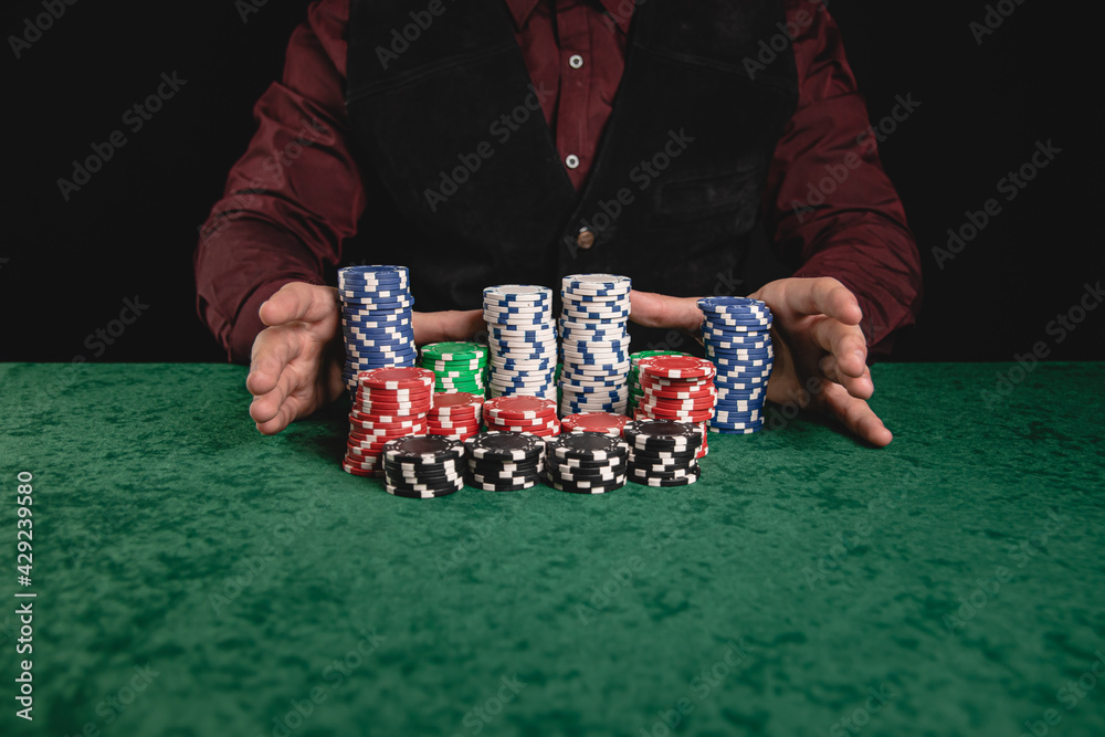 Young gentleman playing poker and going all in Young gentleman playing poker and going all in