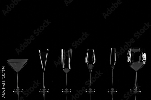 Row of empty wine glasses on black background